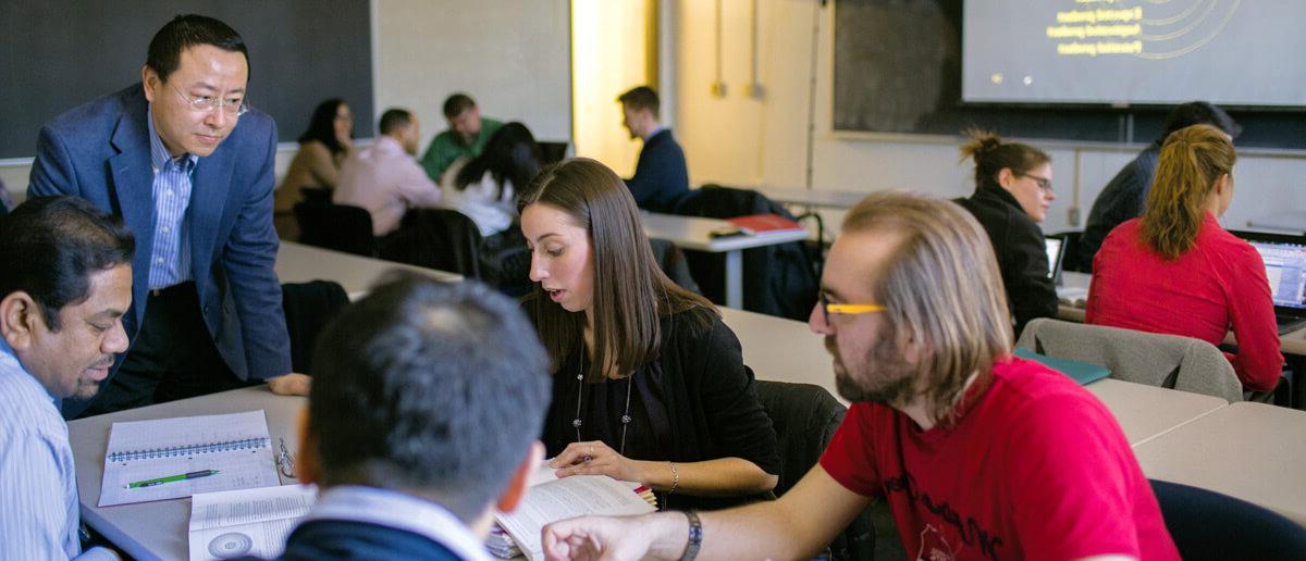 Graduate students in classroom. 